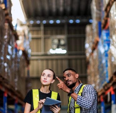 Warehouse worker working in warehouse storage. Foreman or worker work at factory site check up products in site. Inventory worker working in  factory Storehouse